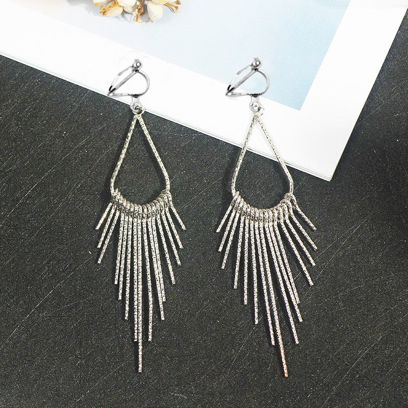 Trendy clip on long textured silver graduated spike earrings