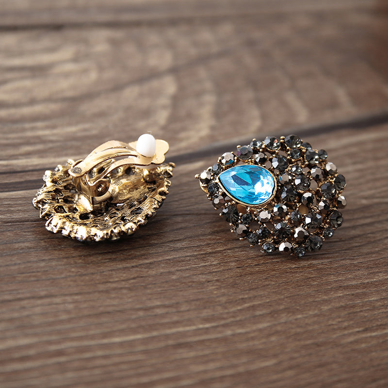 Clip on 3 1/2" lg gold, turquoise and clear stone teardrop princess earrings