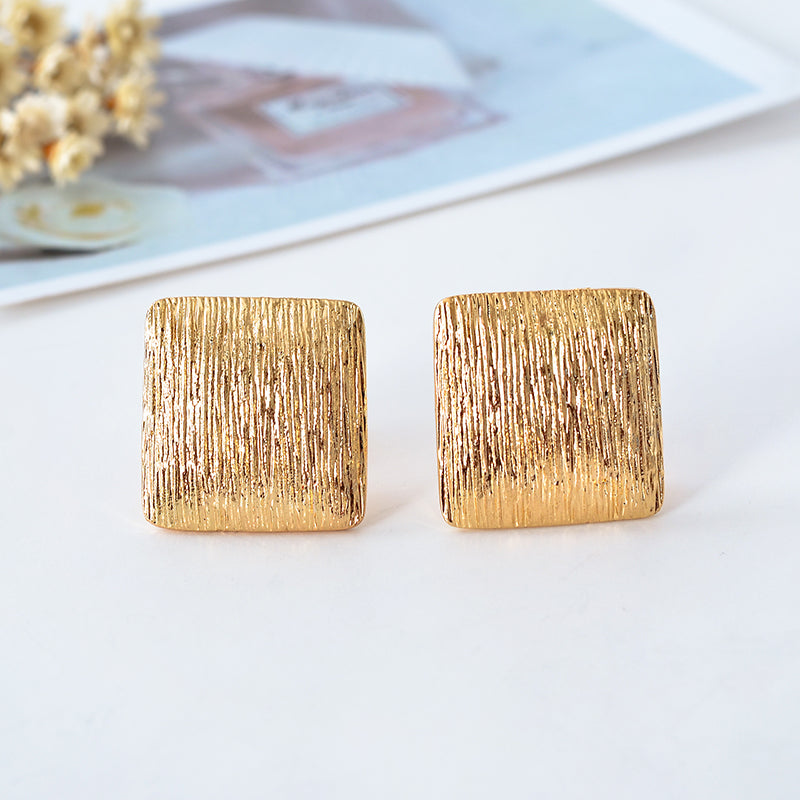 Clip on 1" gold textured square button style earrings