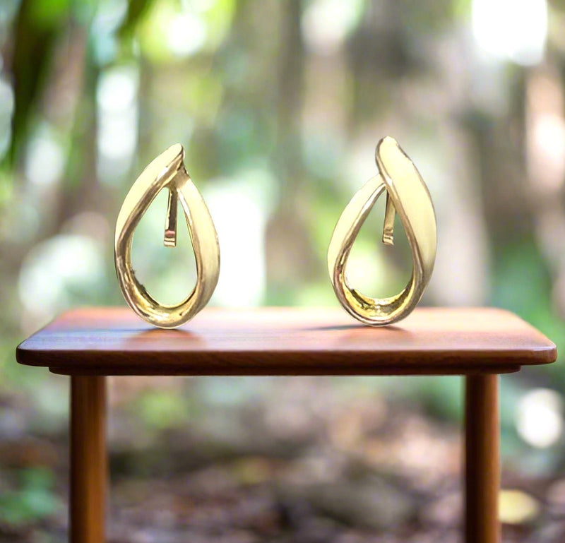 Clip on 1" gold and cream-off white bent button style earrings