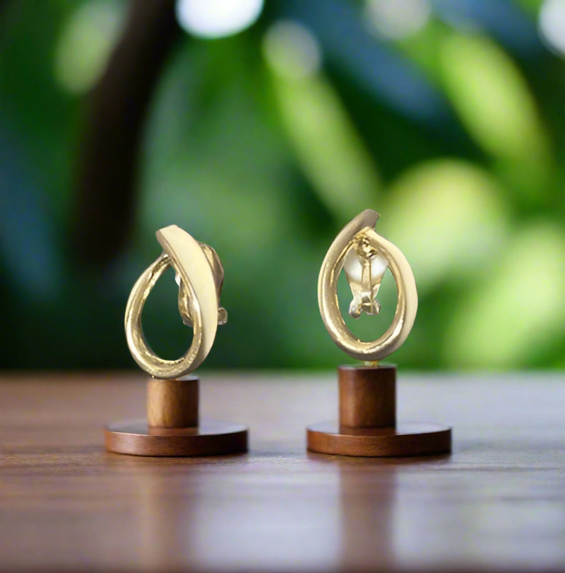 Clip on 1" gold and cream-off white bent button style earrings