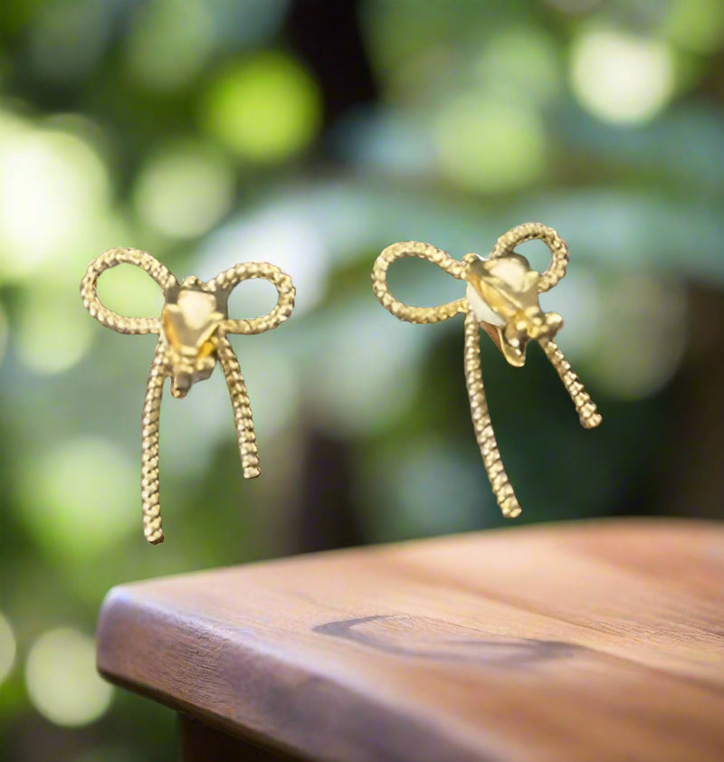 Clip on 1 1/4" gold textured indented bow tie earrings