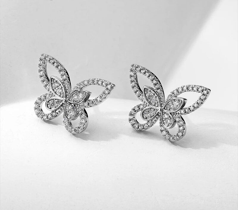 Sterling silver pierced 1/2" silver and clear stone cutout butterfly earrings