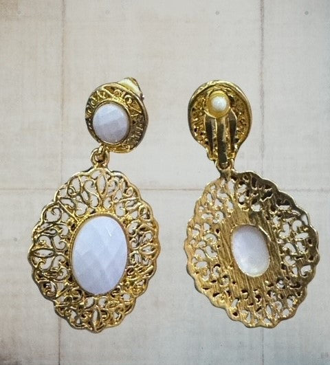 Clip on 2 3/4" gold and white stone dangle earrings with cutout edges