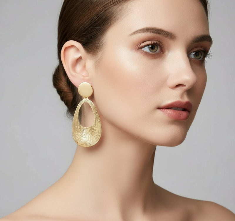 Clip on 2 3/4" lightweight shiny gold bent textured dangle earrings