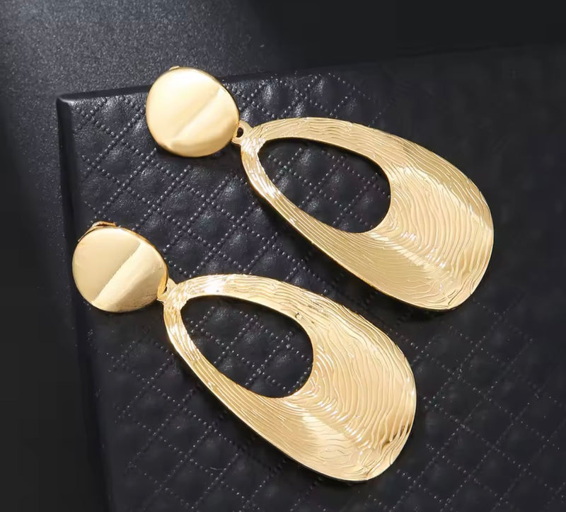 Clip on 2 3/4" lightweight shiny gold bent textured dangle earrings