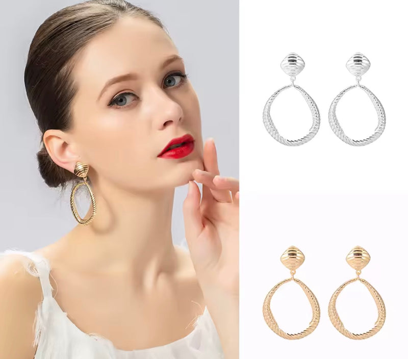 Clip on 2 3/4" large silver indented odd shaped hoop earrings