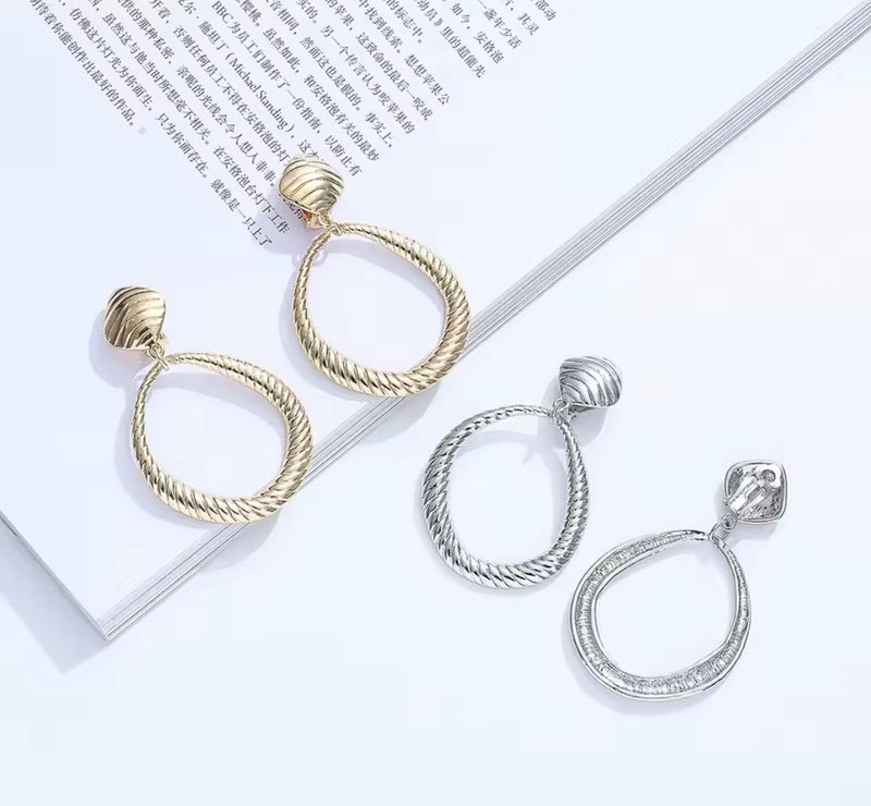 Clip on 2 3/4" large gold indented odd shaped hoop earrings