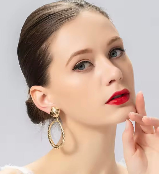 Clip on 2 3/4" large gold indented odd shaped hoop earrings