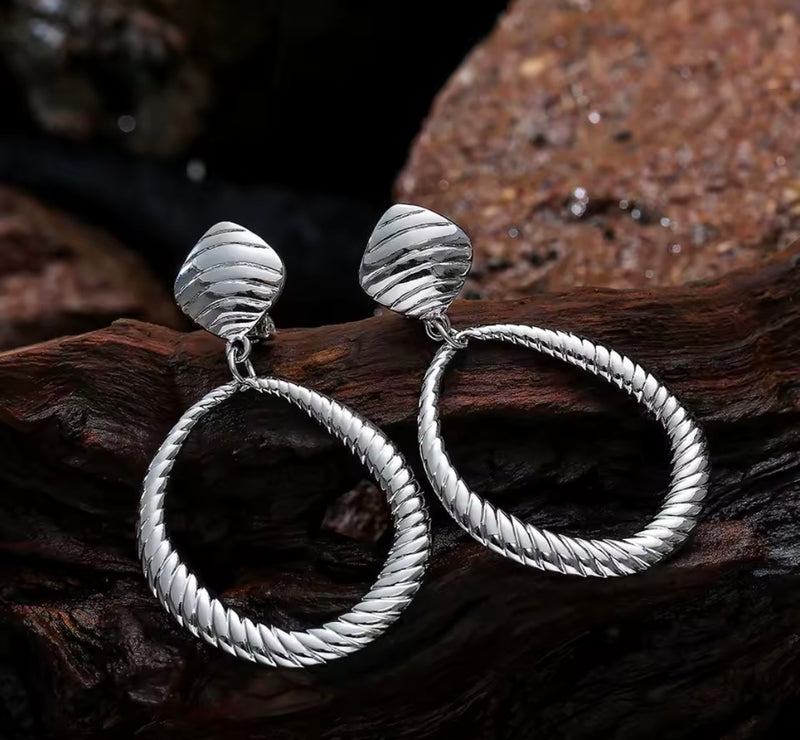 Clip on 2 3/4" large silver indented odd shaped hoop earrings