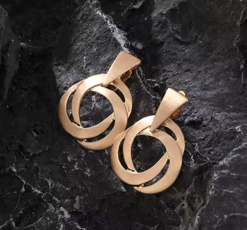 Clip on 1 1/4" large shiny gold loose woven round button style earrings