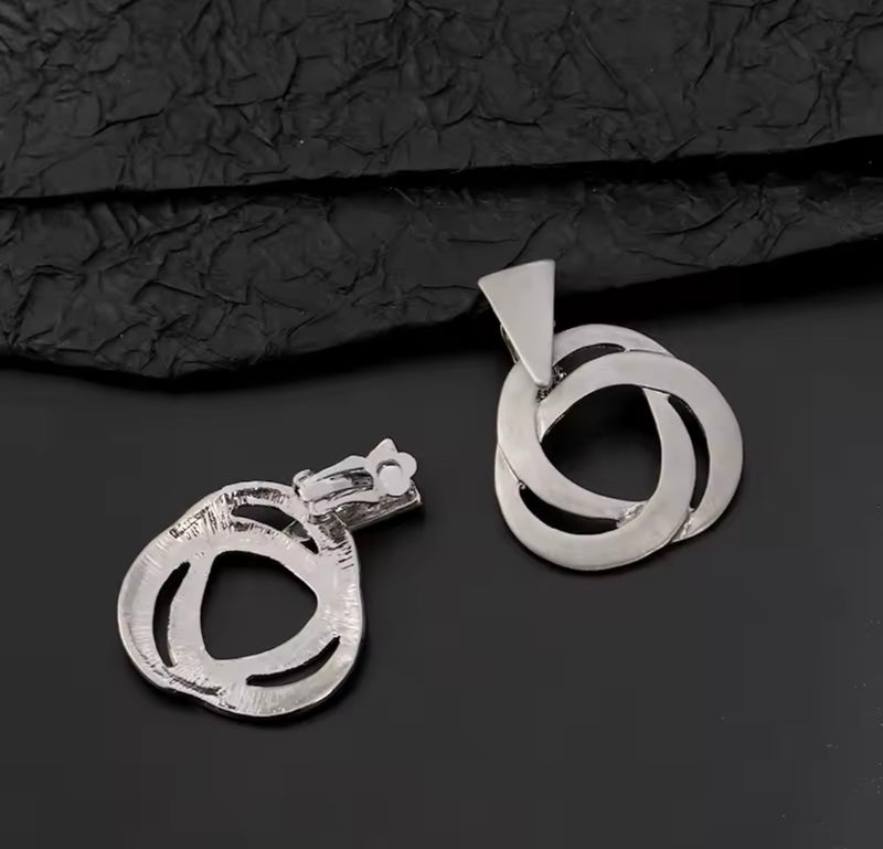 Clip on 1 3/4" matte gold swirl dangle earrings