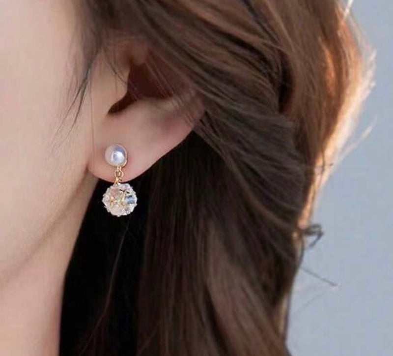 Clip on gold and pearl earrings with dangle clear stone ball