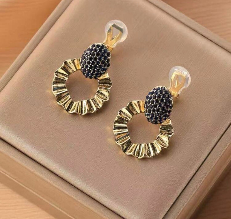 Clip on 1 1/4" gold and dark blue cluster stone dangle wavy hoop earrings