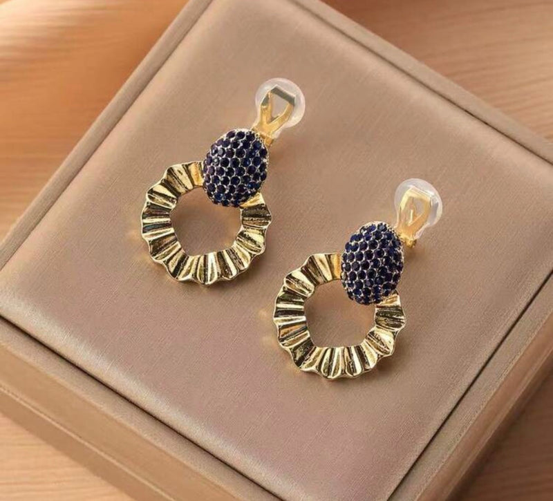 Clip on 1 1/4" gold and dark blue cluster stone dangle wavy hoop earrings