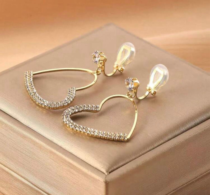 Clip on 1 3/4" gold and clear stone dangle heart earrings