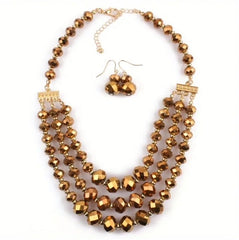 Pierced gold and brown shiny three strand necklace and earrings set