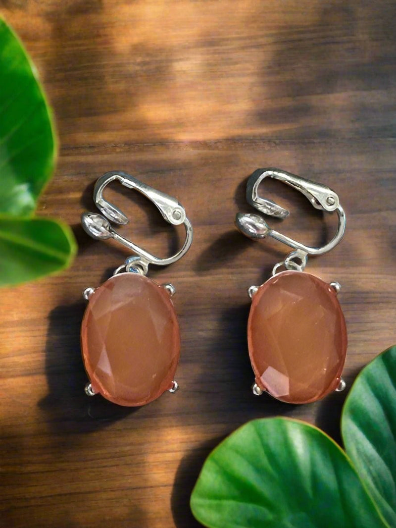 Clip on 1 1/4" silver and orange oval stone dangle earrings