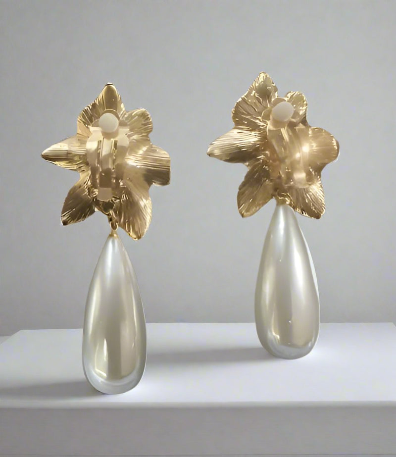 Vintage clip on 2 3/4" shiny gold flower earrings with pearl teardrop