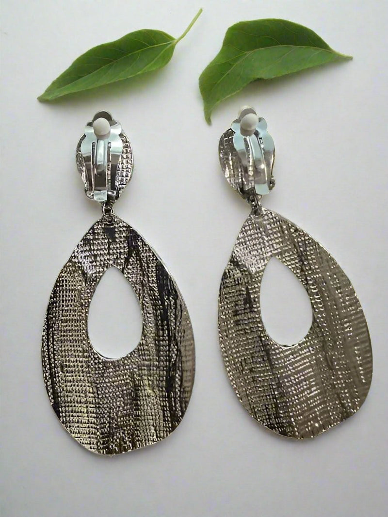 Clip on 3 1/4" silver textured dangle teardrop earrings with clear stones