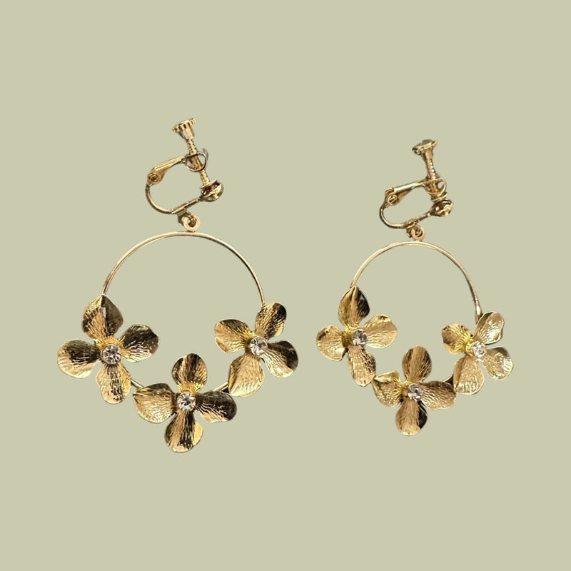 Clip on 2" gold hoop earrings with flowers and clear center stone