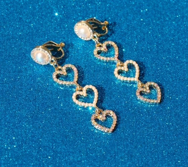 Clip on gold, pearl and fluorescent stone dangle three heart earrings