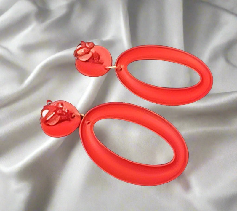 Clip on 2 1/2" long red textured cutout lightweight hoop earrings