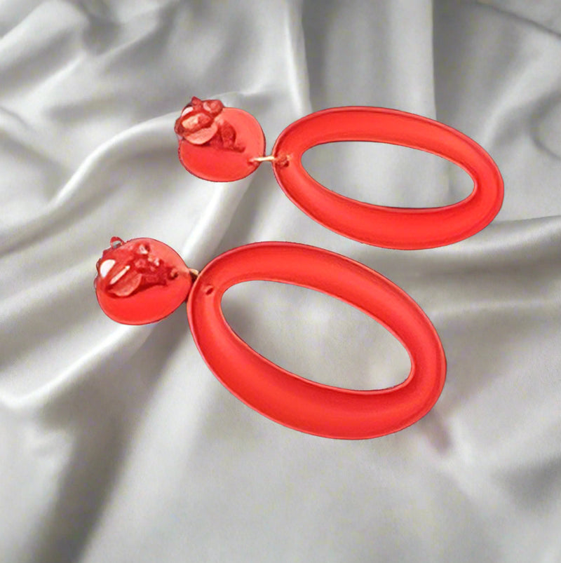 Clip on 2 1/2" long red textured cutout lightweight hoop earrings