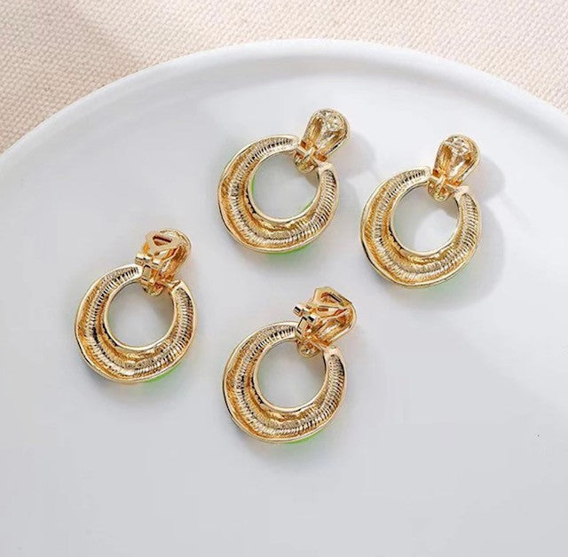 Clip on 1 1/4" gold, black & white stripe dangle hoop earrings