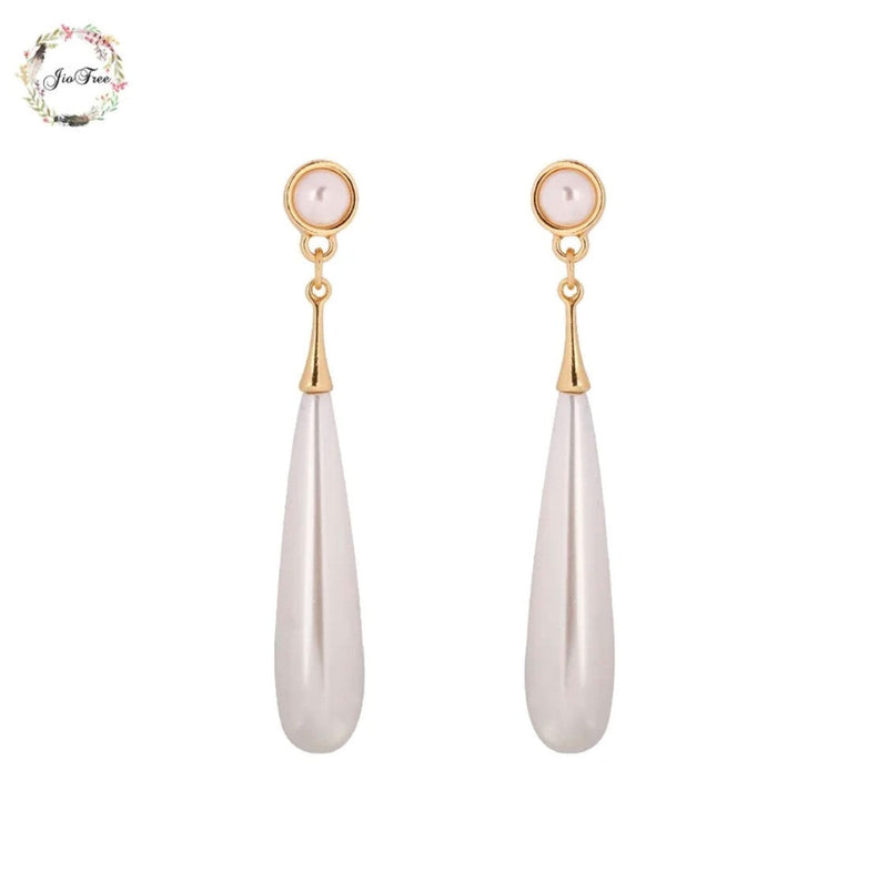 Clip on 2 1/2" gold and white long pearl earrings
