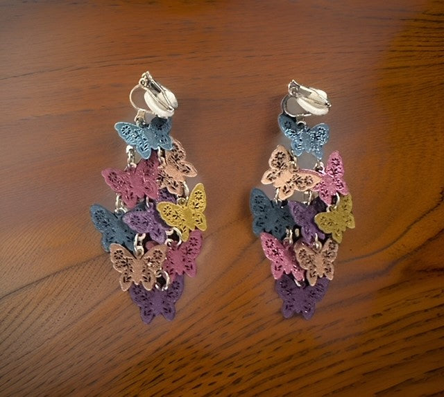 Clip on 2 1/4" silver and multi-colored textured butterfly layered earrings