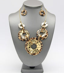 Pierced gold and brown animal print bent circle necklace and earring set