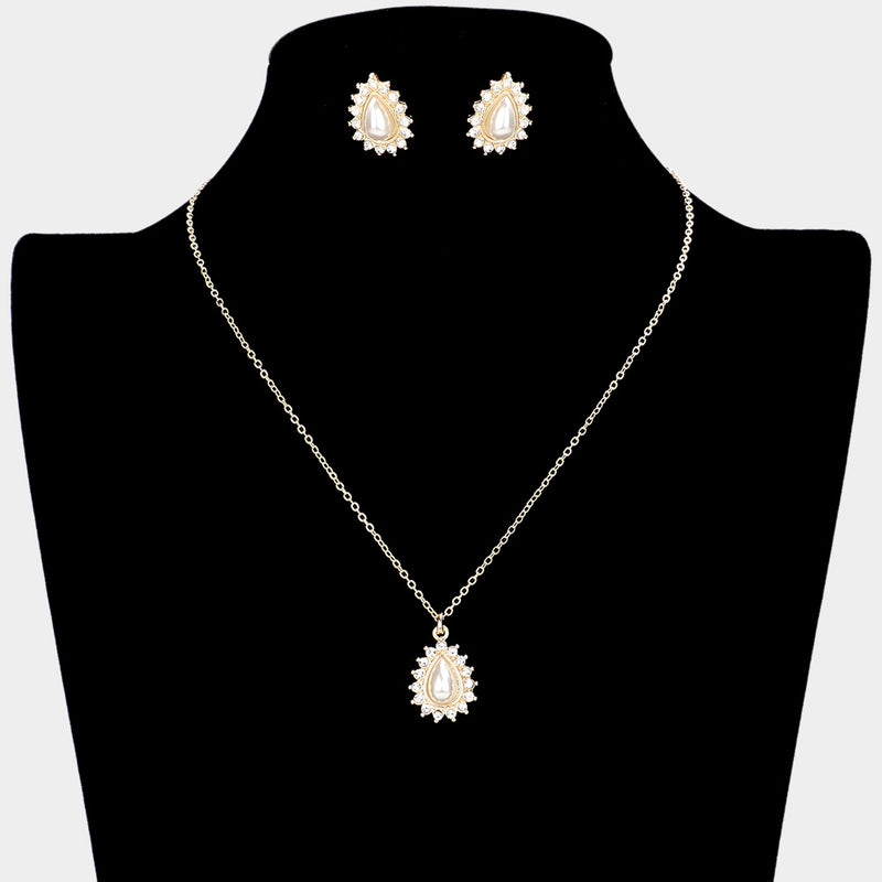 Pierced gold and cream pearl teardrop pendant necklace set with clear stones