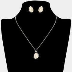 Pierced gold and cream pearl teardrop pendant necklace set with clear stones