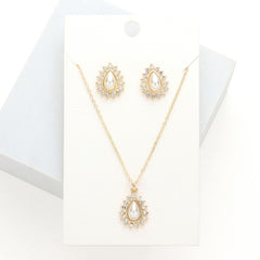 Pierced gold and cream pearl teardrop pendant necklace set with clear stones