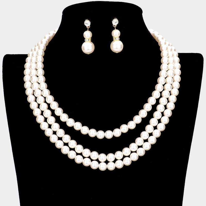 Pierced three strand gold and pearl necklace set with clear stones