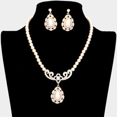 Classy pierced gold, cream pearl teardrop necklace and earring set