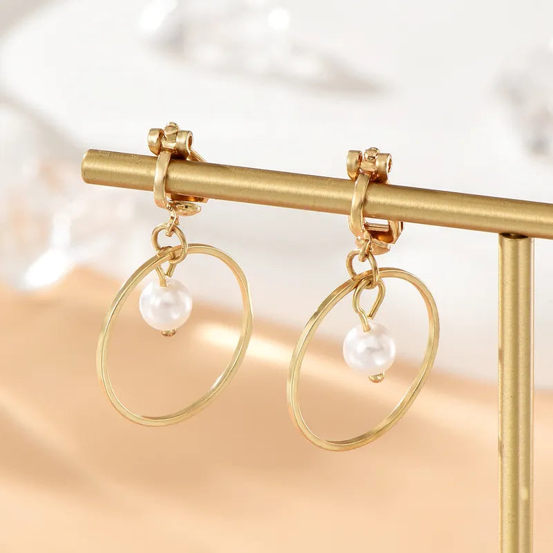 Clip on 1 1/2" gold hoop earrings with white center dangle pearl