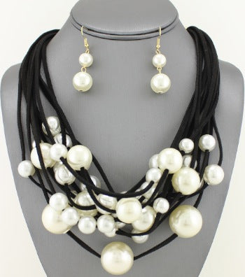 Pierced black suede multi strand white pearl necklace & earring set
