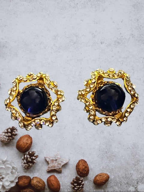 Vintage 1 1/4" gold and clear stone earrings with blue center stone