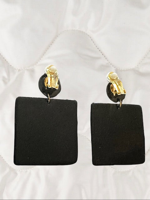 Clip on 2 1/4" gold, black, and white printed dangle square earrings