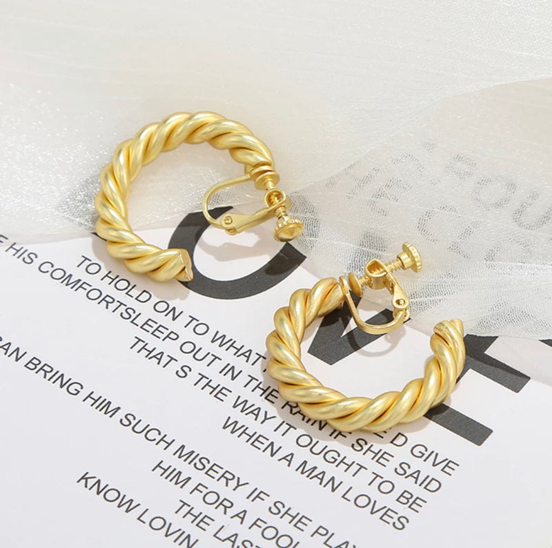 Clip on 1 1/4" matte gold twisted open back hoop earrings