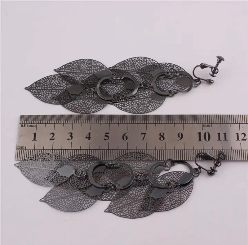 Clip on 4 1/4" long gunmetal layered pinhole dangle leaf earrings