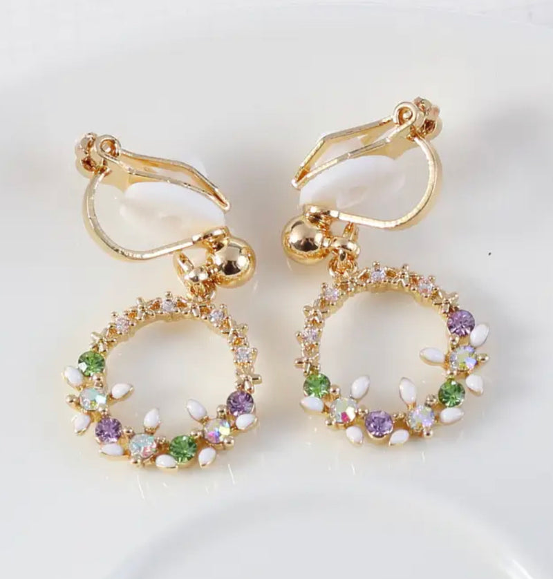 Clip on 1" earrings with dangle gold circle with multi colored stones