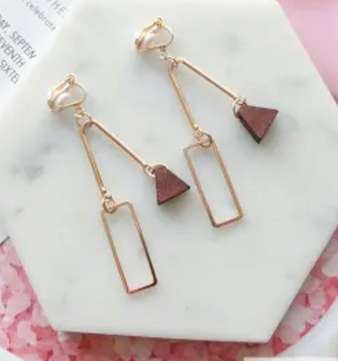 Unique clip on 2 3/4" gold wire and brown wood dangle earrings
