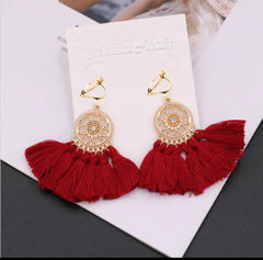 Clip on gold flower circle earrings with thread tassels in a variety of colors