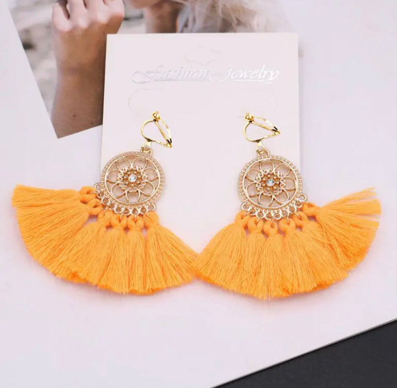 Clip on gold flower circle earrings with thread tassels in a variety of colors