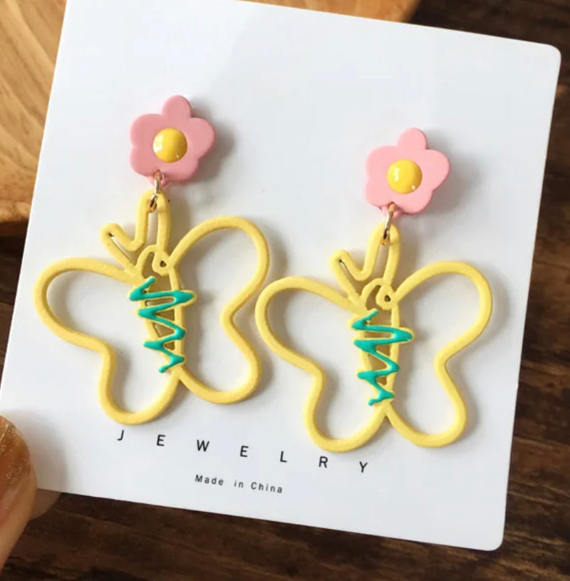 Fun clip on 2" pink, yellow, and green dangle flower and butterfly earrings