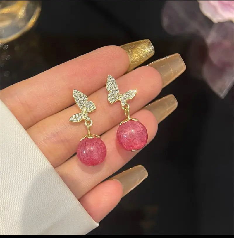 Clip on 1" gold clear stone butterfly earrings with pink dangle bead