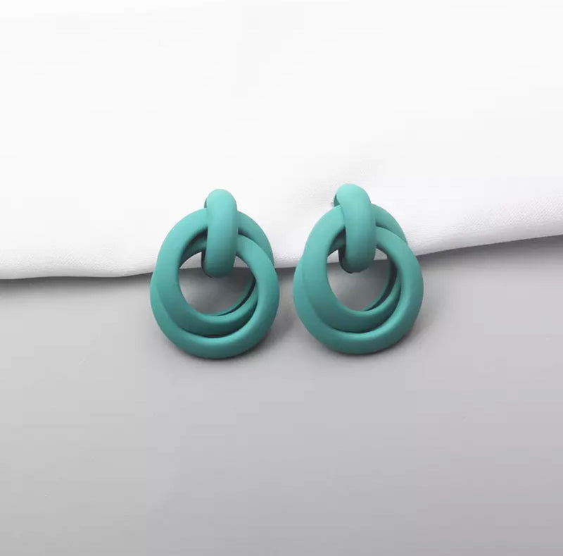 Pierced turquoise painted loose knot earrings